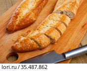 French loaves with chopped slices. Стоковое фото, фотограф Яков Филимонов / Фотобанк Лори