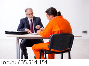 Young captive meeting with advocate in pre-trial detention. Стоковое фото, фотограф Elnur / Фотобанк Лори