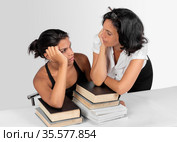 A girl and her mother studying. Стоковое фото, фотограф Julio Rivalta / Фотобанк Лори