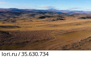 Окрестности озера Байкал. Тажеранская степь осенью. Вид с воздуха. Surroundings of Lake Baikal. Tazheran steppe in autumn. Aerial view. Стоковое видео, видеограф Евгений Романов / Фотобанк Лори