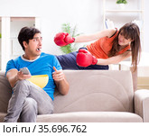 Wife unhappy that husband is watching boxing. Стоковое фото, фотограф Elnur / Фотобанк Лори