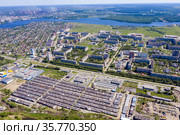 Aerial view on the movement of cars on the ring road. Top view of the city and car junctions. Стоковое фото, фотограф Евгений Ткачёв / Фотобанк Лори