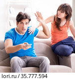Wife unhappy that husband is watching football. Стоковое фото, фотограф Elnur / Фотобанк Лори
