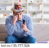 Funny man singing songs in karaoke at home. Стоковое фото, фотограф Elnur / Фотобанк Лори