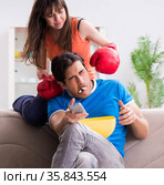Wife unhappy that husband is watching boxing. Стоковое фото, фотограф Elnur / Фотобанк Лори