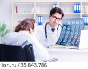 Doctor feeling pessimistic about x-ray image of patient. Стоковое фото, фотограф Elnur / Фотобанк Лори