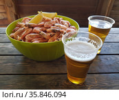 Shrimps with beer on a wooden table. Стоковое фото, фотограф Марина Володько / Фотобанк Лори