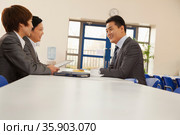 Three business people sitting in company cafeteria. Стоковое фото, агентство Ingram Publishing / Фотобанк Лори