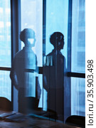 Reflection of businessman looking outside the window . Стоковое фото, агентство Ingram Publishing / Фотобанк Лори