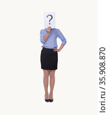 Young businesswoman holding at paper with a question mark on it, obscured face, studio shot. Стоковое фото, агентство Ingram Publishing / Фотобанк Лори