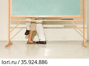 Man and woman behind a blackboard. Стоковое фото, фотограф Shannon Fagan / Ingram Publishing / Фотобанк Лори