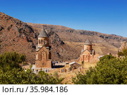 The medieval monastery of Noravank against the backdrop of mountains and blue sky in Armenia. Was founded in 1205. Top view. Стоковое фото, фотограф Наталья Волкова / Фотобанк Лори