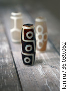 Tibetan Dzi natural beads 9 eyes, Fortune, Turtle. Стоковое фото, фотограф ElenArt / Фотобанк Лори