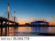 Stadium "Gazprom Arena" on Krestovsky island and Cable-stayed bridge Western high-speed diameter across Peter's fairway in St. Petersburg at sunset, Russia (2018 год). Редакционное фото, фотограф Наталья Волкова / Фотобанк Лори