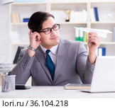 Businessman with paper airplane in office. Стоковое фото, фотограф Elnur / Фотобанк Лори