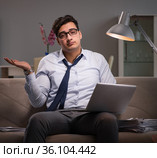 Businessman workaholic working late at home. Стоковое фото, фотограф Elnur / Фотобанк Лори