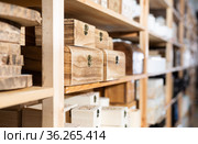 Wooden caskets on supermarket shelves. Стоковое фото, фотограф Яков Филимонов / Фотобанк Лори