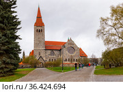 Medieval Tampere cathedral in Finland (Finnish Tampereen tuomiokirkko, Swedish Tammerfors domkyrka) is a church St. John. Famous landmark was built between 1902 and 1907 in national romanticism Style. Стоковое фото, фотограф Алексей Ширманов / Фотобанк Лори