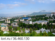 View of the Caucasus Mountains around the city of Pyatigorsk, Russia, with a park, a church, sanatoriums and residential buildings (2021 год). Стоковое фото, фотограф Сергей Фролов / Фотобанк Лори
