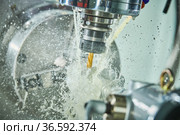CNC milling machine work. metal processing with coolant. Стоковое фото, фотограф Дмитрий Калиновский / Фотобанк Лори