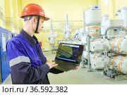 industrial technicians works at power energy supply factory. Стоковое фото, фотограф Дмитрий Калиновский / Фотобанк Лори