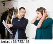 Frustrated woman talking to debt collector. Стоковое фото, фотограф Яков Филимонов / Фотобанк Лори
