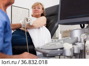 Woman during examination of hand with ultrasonography device. Стоковое фото, фотограф Яков Филимонов / Фотобанк Лори