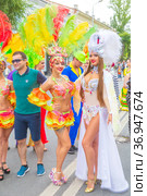 Russia, Samara, July 2019: processions of beautiful dressed up girls on Kuibyshev street at the carnival dedicated to the World Cup. Редакционное фото, фотограф Акиньшин Владимир / Фотобанк Лори