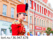 Russia, Samara, July 2019: a beautiful girl in a hussar costume on Kuibyshev street at the carnival dedicated to the World Cup. Редакционное фото, фотограф Акиньшин Владимир / Фотобанк Лори