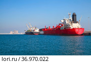 Red tanker ship is loading in port of Saudi Arabia, stern view (2019 год). Стоковое фото, фотограф EugeneSergeev / Фотобанк Лори