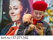 Проводница Аня (Актриса: Мария Николаева) из фантастического видеоролика "Русский космопоезд" направления Birchpunk на фестивале Bubble Comics Con в Москве, Россия (2021 год). Редакционное фото, фотограф Николай Винокуров / Фотобанк Лори