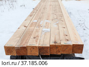 Square-sawn timber for wooden house construction. Dry planed inscriptions as stamp. Стоковое фото, фотограф Кекяляйнен Андрей / Фотобанк Лори