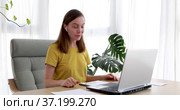 woman is speaking on video call with friend client colleague using laptop computer. Стоковое видео, видеограф Ekaterina Demidova / Фотобанк Лори