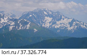 Северный Кавказ. Плато Лаго-Наки. Вид на Большой Кавказский хребет. North Caucasus. Lago-Naki Plateau. View of the Great Caucasian Ridge. (2021 год). Редакционное видео, видеограф Евгений Романов / Фотобанк Лори