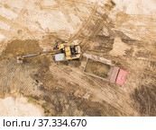 Aerial view of a excavator in the mine. Use drones to inspect of your business. Drone air shot. Стоковое фото, фотограф Игорь Кривошеев / Фотобанк Лори