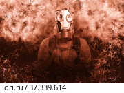 A shot of a man dressed in a gas mask, a hooded jacket, a backpack, crossed his arms on his chest, looking into the camera. background grunge. Стоковое фото, фотограф Владимир Арсентьев / Фотобанк Лори