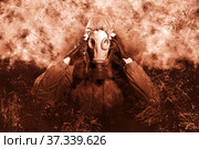 A shot of a man dressed in a gas mask, a jacket with a hood, a backpack, holding his fingers at the temple, a headache. A poster on the background of grunge. Стоковое фото, фотограф Владимир Арсентьев / Фотобанк Лори