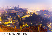 Illuminated Bergamo upper city in misty winter twilights, Italy. Стоковое фото, фотограф Яков Филимонов / Фотобанк Лори