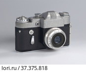 Old reflex camera lies on a white background. Стоковое фото, фотограф Евгений Ладченко / Фотобанк Лори