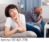 Sad family having difficulties in the living room at home. Стоковое фото, фотограф Яков Филимонов / Фотобанк Лори