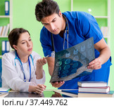 Woman and man doctors radiologists working at the clinic. Стоковое фото, фотограф Elnur / Фотобанк Лори
