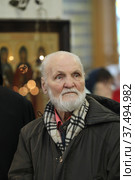 Писатель Владимир Николаевич Крупин в Казанском храме Реутова (2022 год). Редакционное фото, фотограф Дмитрий Неумоин / Фотобанк Лори