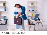 Male employee coming to work straight from bed. Стоковое фото, фотограф Elnur / Фотобанк Лори