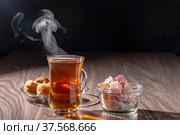 Turkish tea and sweets on a wooden table. Стоковое фото, фотограф Андрей Никитин / Фотобанк Лори