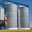 Modern metal grain elevator. Blue sky. Стоковое фото, фотограф Alexey Rezvykh / Фотобанк Лори