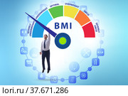 Concept of BMI - body mass index with man. Стоковое фото, фотограф Elnur / Фотобанк Лори