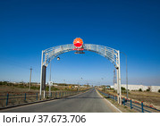 Emba, Aktobe region, Kazakhstan. Portal of CNPC company on oil refinery and gas processing plant in desert. (2012 год). Редакционное фото, фотограф Alexey Rezvykh / Фотобанк Лори