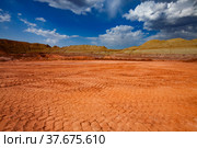 Aluminium ore quarry. Bauxite clay open-cut mining. Truck trails on the ground. Green grass on the heaps. Blue sky with clouds. Panoramic view. Стоковое фото, фотограф Alexey Rezvykh / Фотобанк Лори