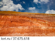Aluminium ore mining and transporting. Bauxite clay quarry. Scratches on terrain from excavator bucket. Стоковое фото, фотограф Alexey Rezvykh / Фотобанк Лори