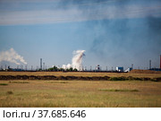 Panorama view on steppe and explosion. White cloud and black smoke. Coal quarry in Kazakhstan. Стоковое фото, фотограф Alexey Rezvykh / Фотобанк Лори